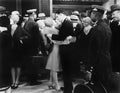 Couple embracing at a train station