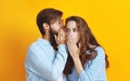 Couple of emotional people man and woman on yellow background Royalty Free Stock Photo