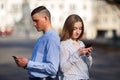 Couple engrossed in messaging