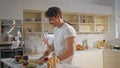 Couple enjoy family breakfast cooking together on cozy kitchen. Happy spouses Royalty Free Stock Photo