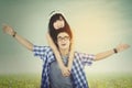 Couple enjoy freedom at field with instagram filter