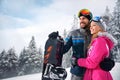 Couple enjoy skiing on mountain
