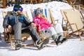 Couple enjoy at sun on ski terrain Royalty Free Stock Photo