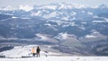 Couple enjoying beautiful alpine view with snow mountains during winter, Slovakia, Europe Royalty Free Stock Photo