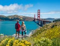 Couple holding hands looking at beautiful coastal landscape. Royalty Free Stock Photo