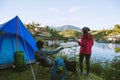 Couple Enjoying Camping Holiday In Countryside.Camp in the mountains near of the lake Royalty Free Stock Photo