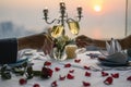 Couple enjoying of Cheers glass of wine in a restaurant at sunset.