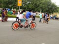 Couple enjoying cycling with two pair of pedals together.