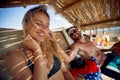 Couple enjoying day at beach. Man showing affection toward woman, caressing her hair. Summertime vacation. Holiday, fun, lesiure,