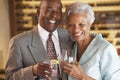 Couple Enjoying A Drink At A Bar Together