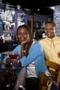 Couple enjoying drinks at bar Royalty Free Stock Photo