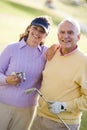 Couple Enjoying A Game Of Golf Royalty Free Stock Photo