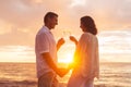 Couple Enjoying Glass of Champene on the Beach at Sunset Royalty Free Stock Photo