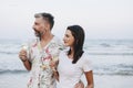 Couple enjoying a glass of wine by the beach Royalty Free Stock Photo