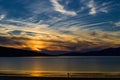 Couple enjoying gorgeous sunset on the beach.