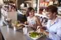 Couple Enjoying Lunch Date In Delicatessen Restaurant Royalty Free Stock Photo