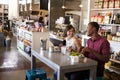 Couple Enjoying Lunch Date In Delicatessen Restaurant Royalty Free Stock Photo