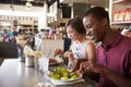 Couple Enjoying Lunch Date In Delicatessen Restaurant Royalty Free Stock Photo