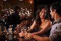 Couple Enjoying Night Out At Cocktail Bar Royalty Free Stock Photo