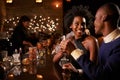 Couple Enjoying Night Out At Cocktail Bar Royalty Free Stock Photo