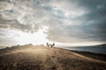 Couple enjoying the outdoor freedom and leisure activity sitting in front of the ocean. travel and alternative vacation concept