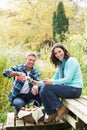 Couple Enjoying Picnic In Autumn