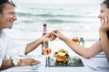 Couple enjoying a private beach dinner