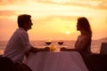 Couple enjoying romantic sunnset dinner Royalty Free Stock Photo