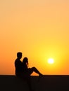 Couple enjoying Santorini island from the Firostefani Church balcony