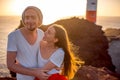 Couple enjoying summer vacation near the lighthouse Royalty Free Stock Photo