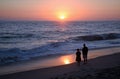 Couple enjoying the sunset on Aliso Beach. Royalty Free Stock Photo