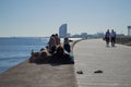 Couple Enjoying Sunshine by the Sea in Barcelona, Spain Royalty Free Stock Photo