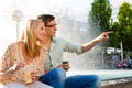 Couple enjoying take away coffee in a break Royalty Free Stock Photo