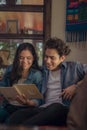 Couple enjoying together watching a photo album. Couple on valentine's day