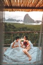 A couple enjoying a vacation at a coastal resort with beautiful landscapes at sunset. honeymoon destination at Phangnga ,Thailand