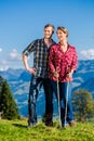 Couple enjoying view hiking in the mountains Royalty Free Stock Photo