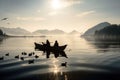 Couple enjoying view by rowboat at sunset by lake and mountainside. Royalty Free Stock Photo