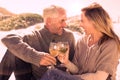Couple enjoying white wine on picnic at the beach Royalty Free Stock Photo