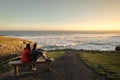 Couple enjoys beautiful coastal scenery near Dunedin in New Zealand