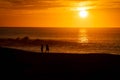 A couple enjoys the Desert sunrise in Cabo San Lucas Mexico