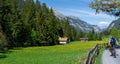Couple enjoys mountain biking in an idyllic Swiss Alps mountain landscape