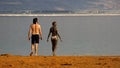 Couple on Dead sea beach, Ein Bokek, Israel