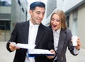 Couple enterpreneurs are examining documents before signing Royalty Free Stock Photo