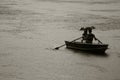 A couple is escaping the heavy rain on a boat in Central Park in New York