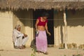 Couple of ethnic taru people in traditional house in Nepal