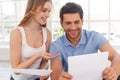 Couple examining documents.