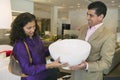 Couple Examining Large Bowl in furniture store