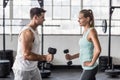 couple exercising with dumbbells in gym Royalty Free Stock Photo