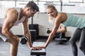 couple exercising with dumbbells in gym Royalty Free Stock Photo