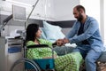 Couple expecting child in hospital ward talking Royalty Free Stock Photo